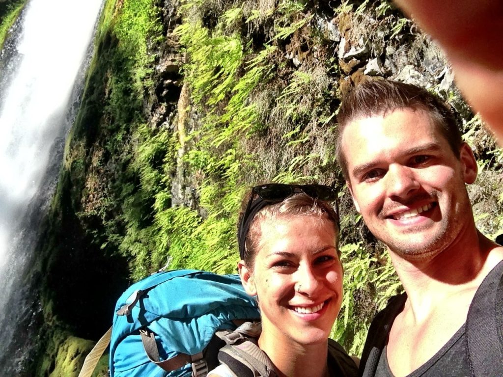 Joe & Emily backpacking through tunnel falls Oregon. 
