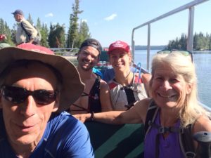 Chuck, Joe, Emily, and Sue on Jenny Lake boat headed to lake Solitude