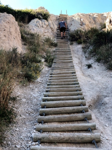 Joe Hiking Stairs in Badlands National Park van life