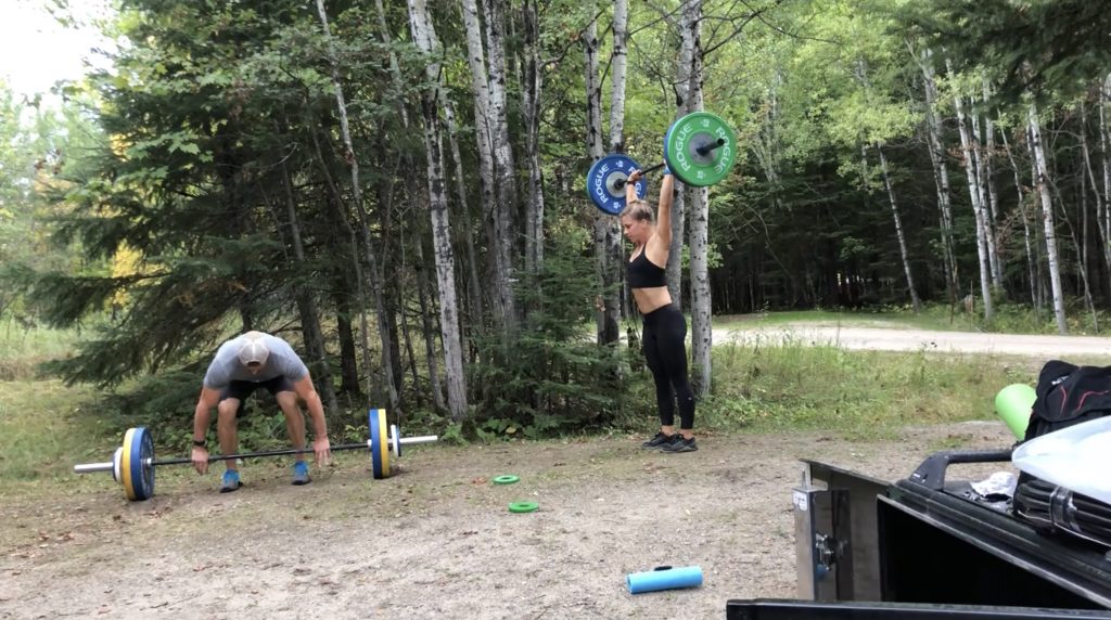 Joe and Emily lifting weights at the Woodenfrog campground near Voyageurs National Park