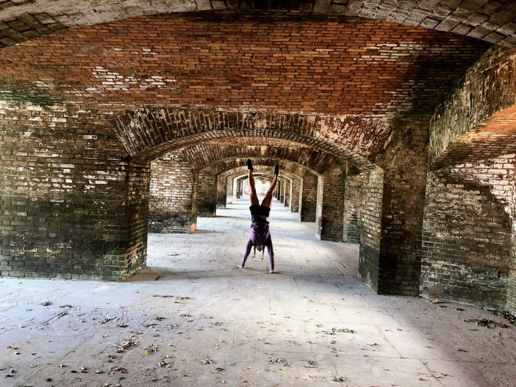 Emily handstand walking through Dry Tortugas National Park