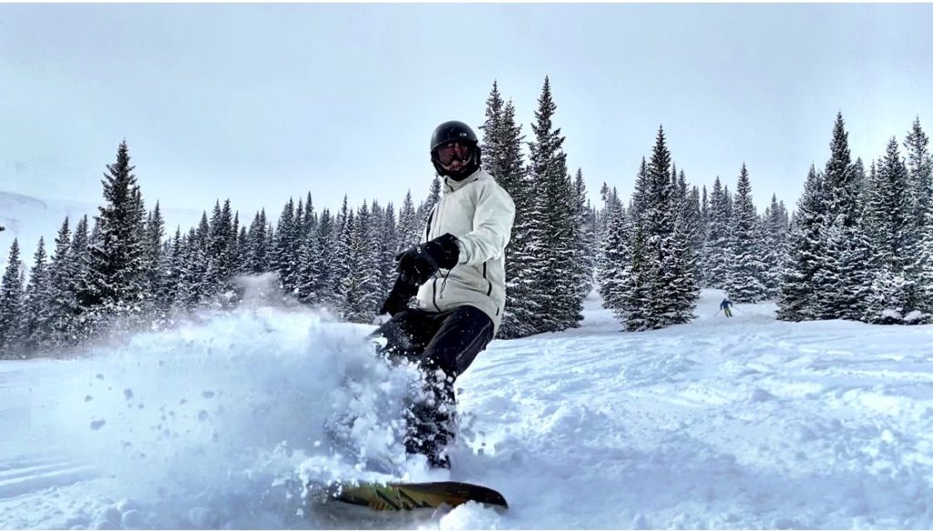Joe snowboarding a powder day at Snowmass on IKON pass
