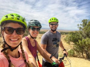 Emily, Sarah, and Joe riding biked in Fruita