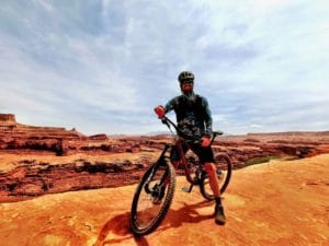 Joe riding mountain bike on White Rim trail
