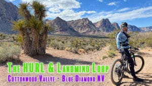 MTB - Mountain Biking The Hurl & Landmine Loop - Blue Diamond NV with Joe riding his revel rascal with Red Rocks in background
