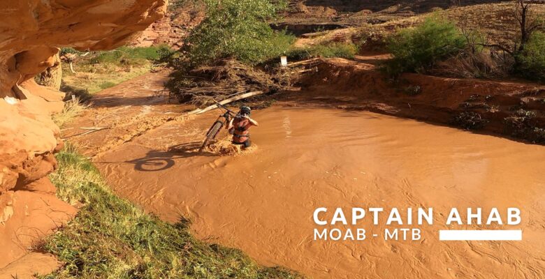 Carrying bikes through the river to Captain Ahab Moab