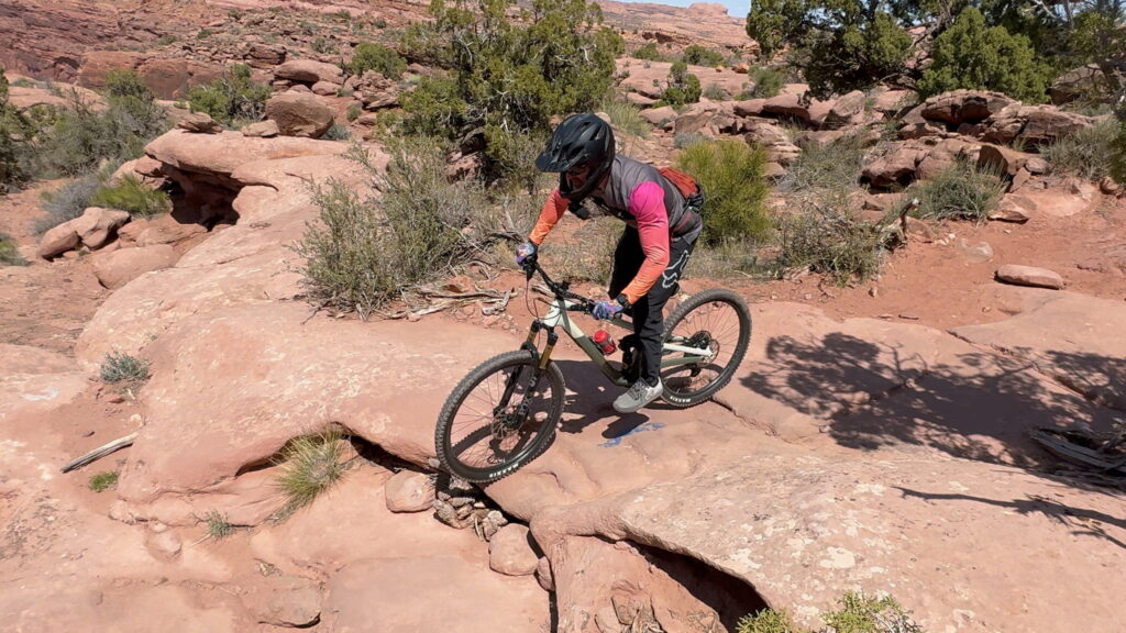 Riding Norco Sight on downhill tech in Moab