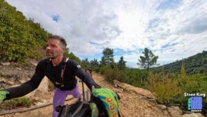 Hiking up a hill with our bikes for Stone King Day 6 in Italy