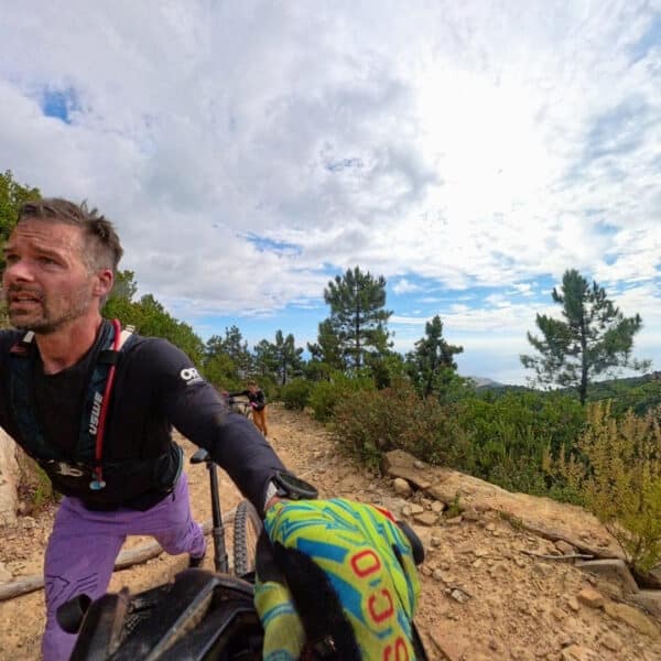 Hiking up a hill with our bikes for Stone King Day 6 in Italy