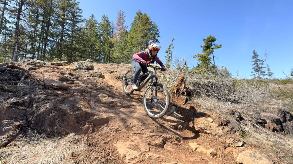 Emily riding the Norco Sight VLT TQ down the chunk